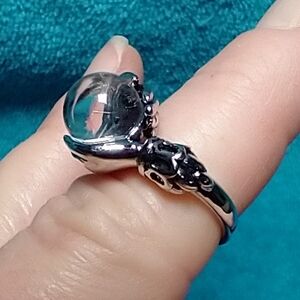 Silvertone crystal ball magic ring